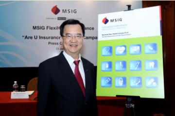 Mr Chua with the FlexiHealth advertising banner.
